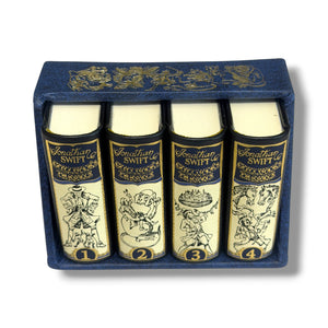 Set of four books with decorative covers in a blue box, resembling Jonathan Swift's works. Gulliver's Travels
