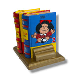 Bookend shaped like a stack of books with a cartoon character on a white background Mafalda