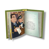 Open book with illustrated pages featuring two characters and a dog, on a white background.102 Dalmatas