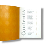 Ganesh, Open book showing a table of contents with decorative yellow page and white text.