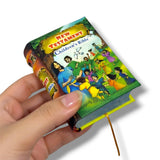 Children's Bible held by a hand on a white background