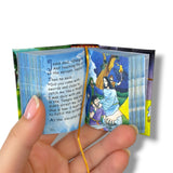 Children's Bible Miniature book with colorful illustrations and text held by a hand