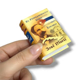 Miniature book with a portrait on a white background. Jose Marti
