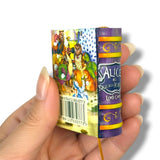 Hand holding a colorful candy bar with 'Alice' branding against a white background