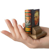 Van Gogh-themed bookend held in a hand against a white background